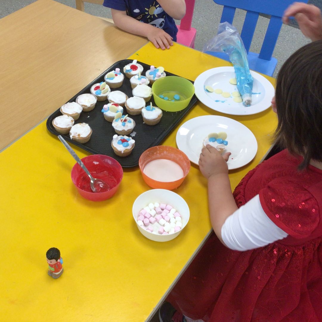 nursery children icing cakes